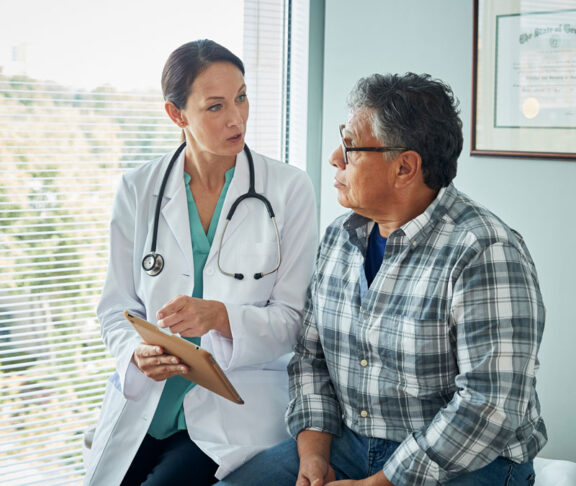 Doctor speaks with male patient